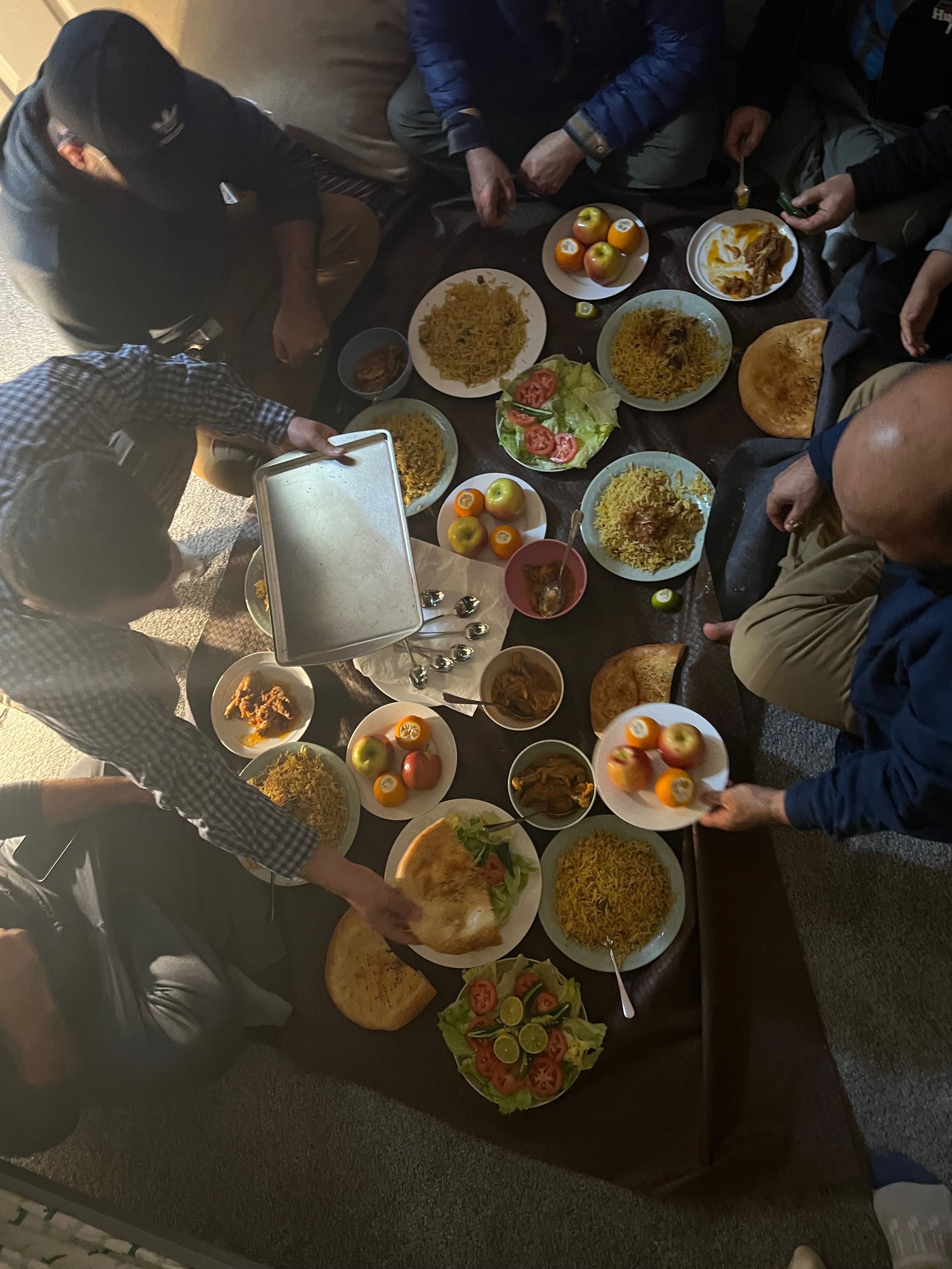 The Afghan family Karim and Kiley hosted, sharing a meal together